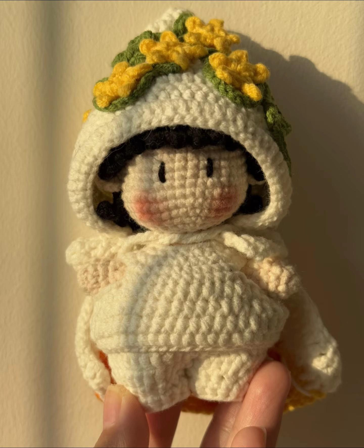 Adorable Crochet Doll with Flower-Embellished Hooded Cape Pattern