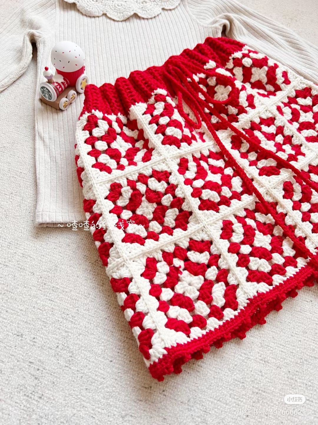 Cozy Crochet Outfit with Intricate Lace Collar and Patterned Skirt