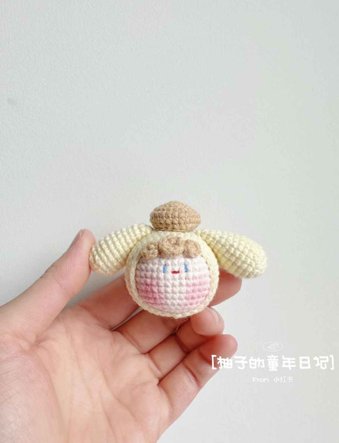Cute Crochet Bunny Toy Surrounded by Colorful Yarn Balls