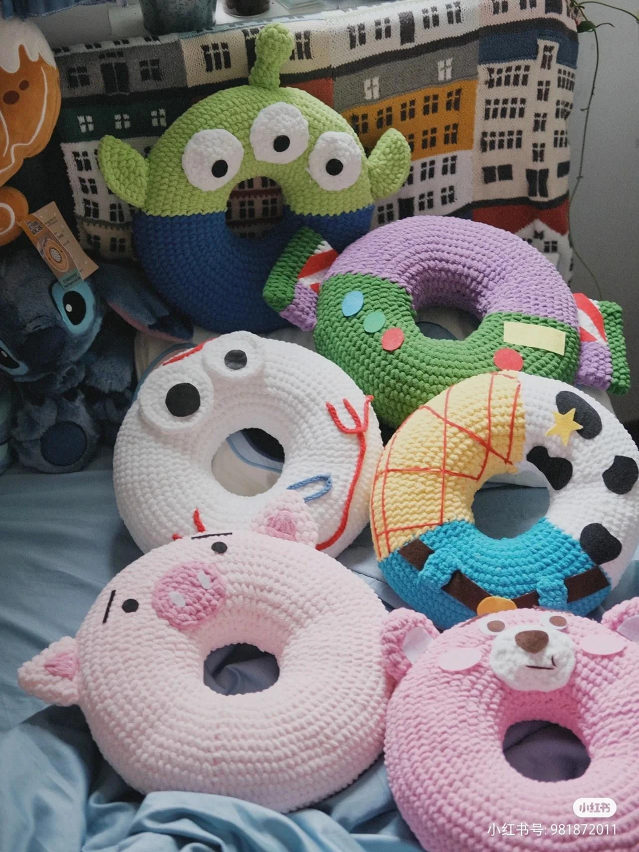 Colorful Crocheted Donut Stacker with Cute Animal Faces