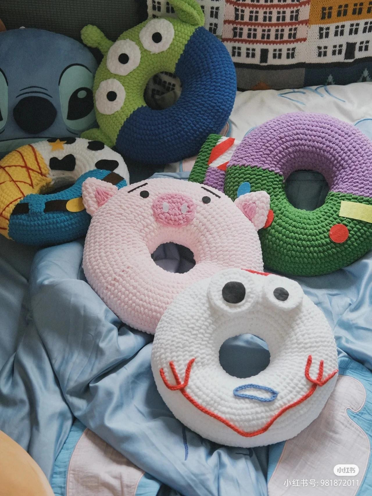 Colorful Crocheted Donut Stacker with Cute Animal Faces