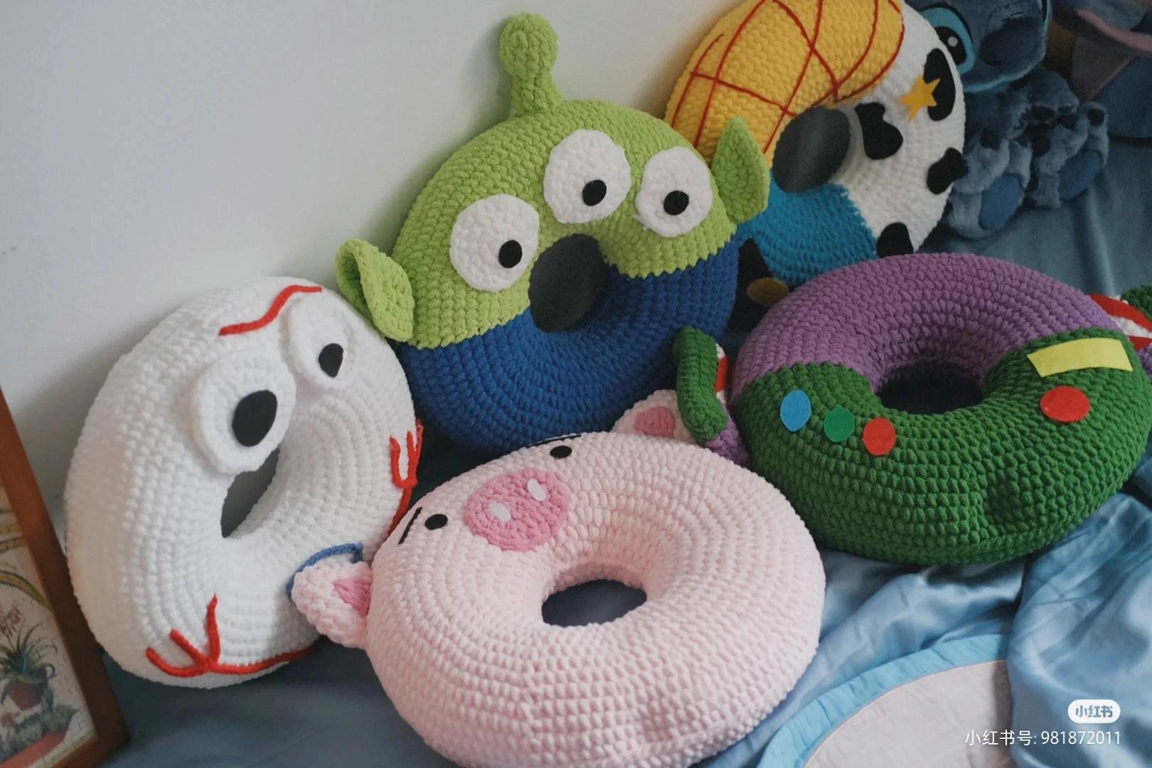 Colorful Crocheted Donut Stacker with Cute Animal Faces