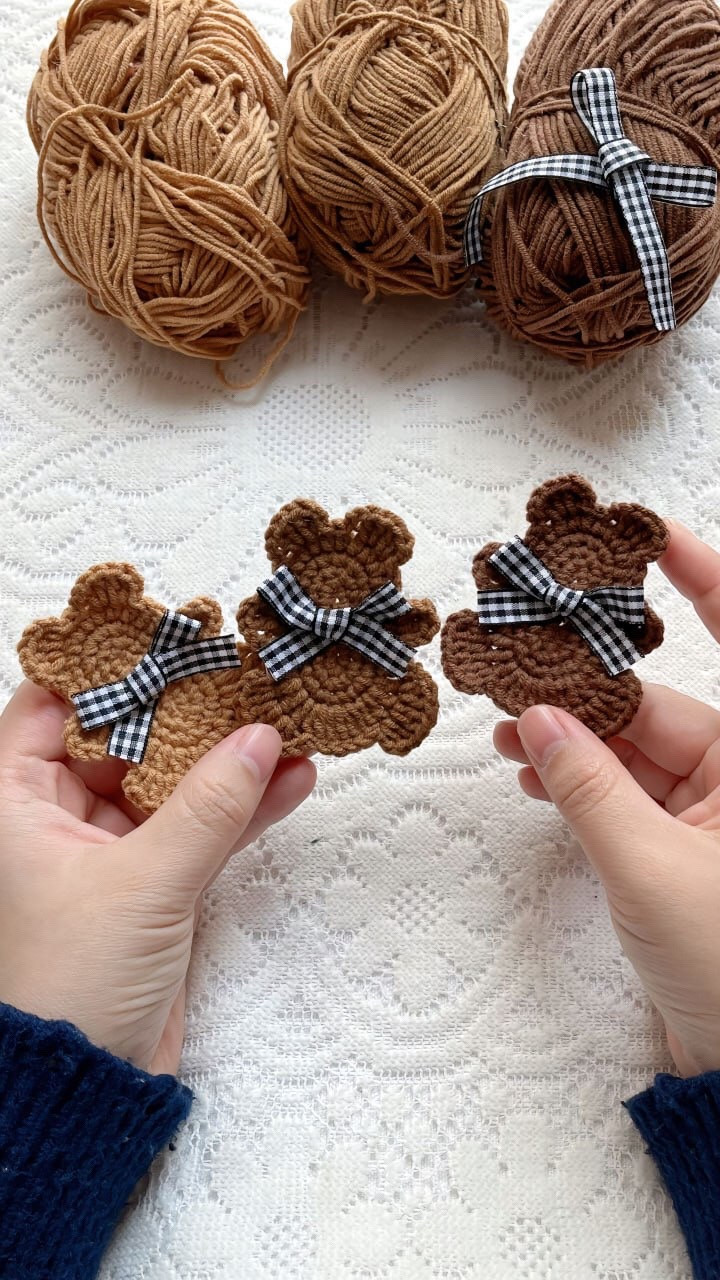 Crochet Teddy Bear Pattern with Checkered Bows and Brown Yarn