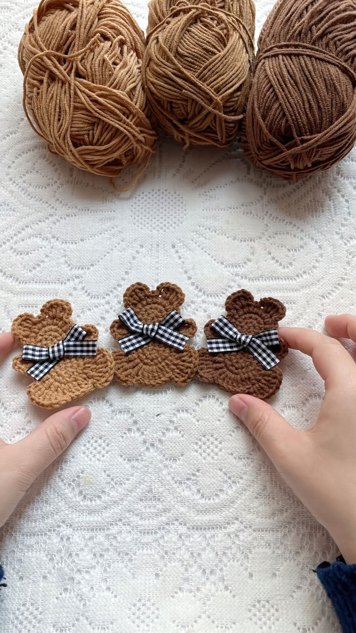 Crochet Teddy Bear Pattern with Checkered Bows and Brown Yarn