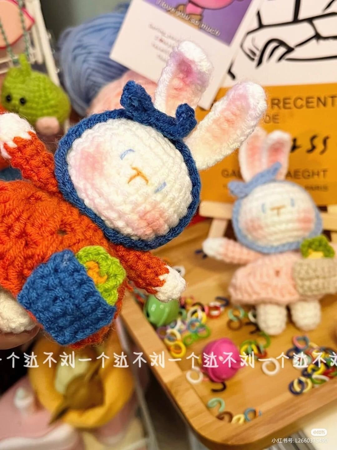 Cute Crochet Bunny Pair with Accessories and Yarn Display