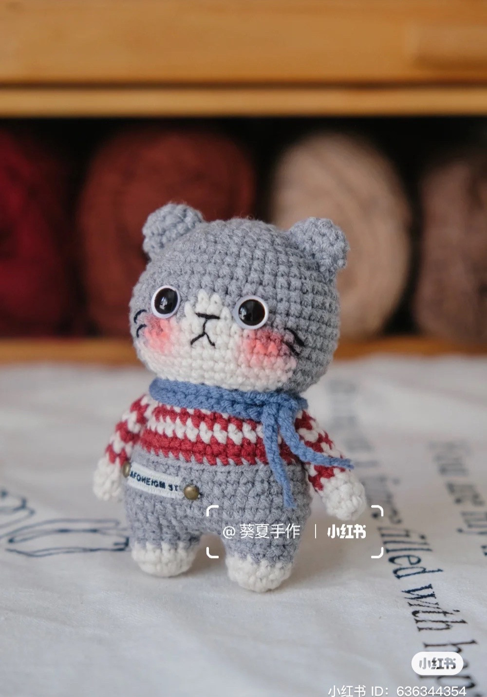 Cute Crochet Kitten in Striped Sweater and Blue Scarf