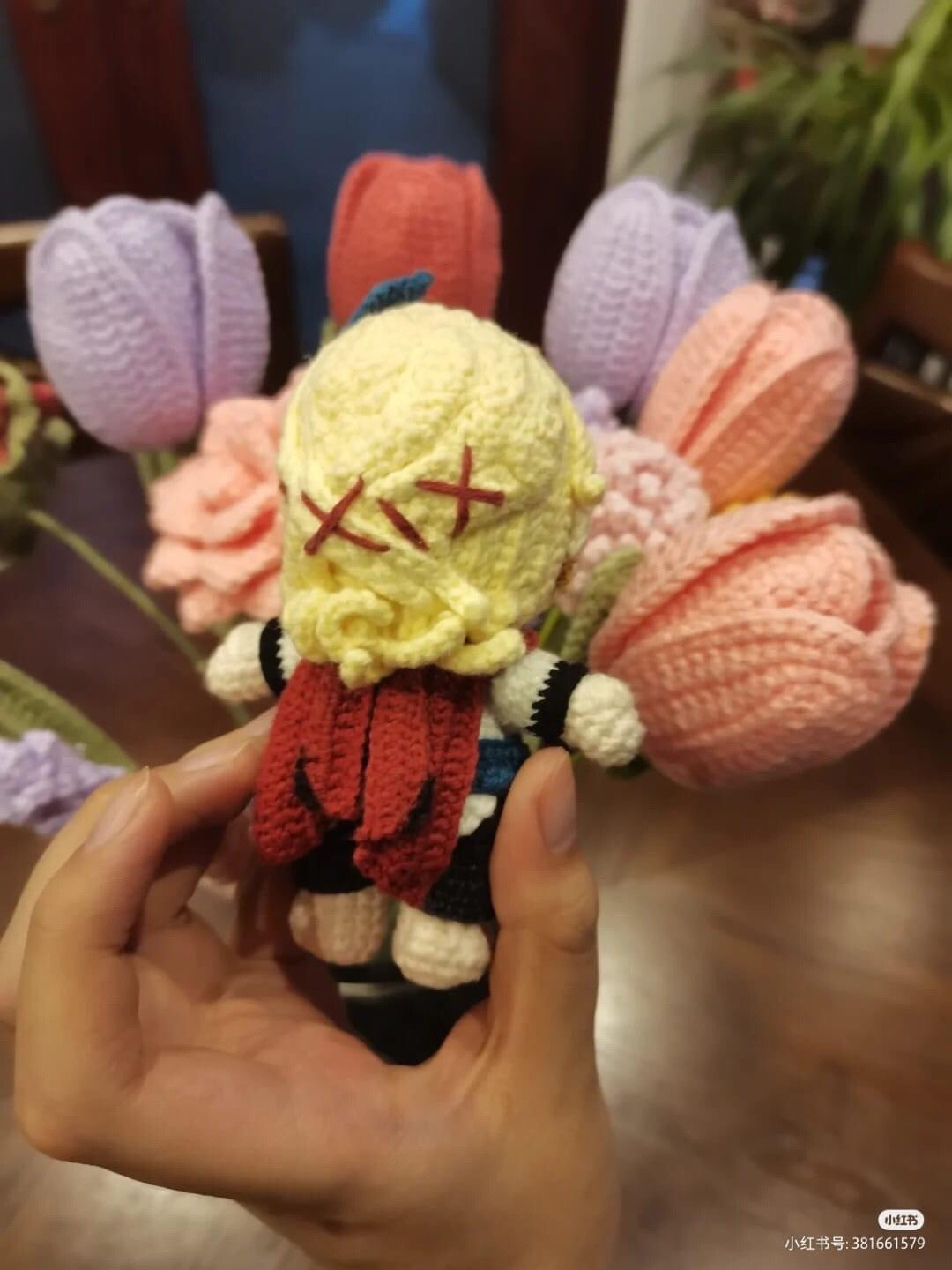 Handmade Crochet Doll with Colorful Yarn Background