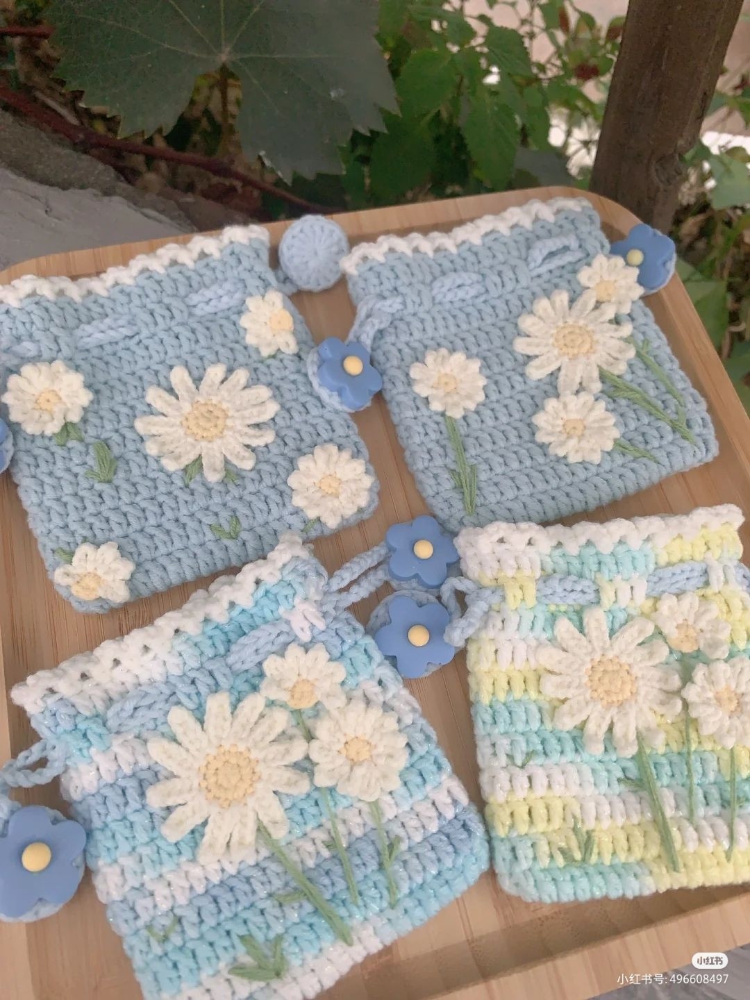 Handmade Crochet Pouches with Daisies and Blue Flower Details