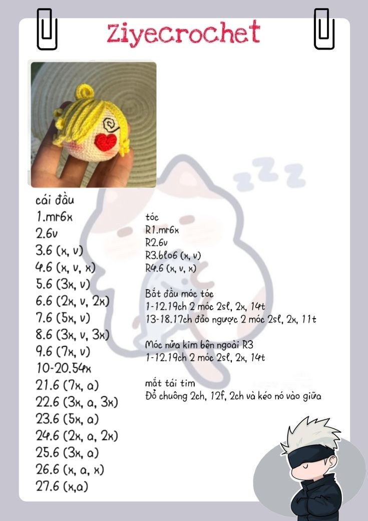 Búp bê móc len hình đầu nhân vật với trái tim đỏ