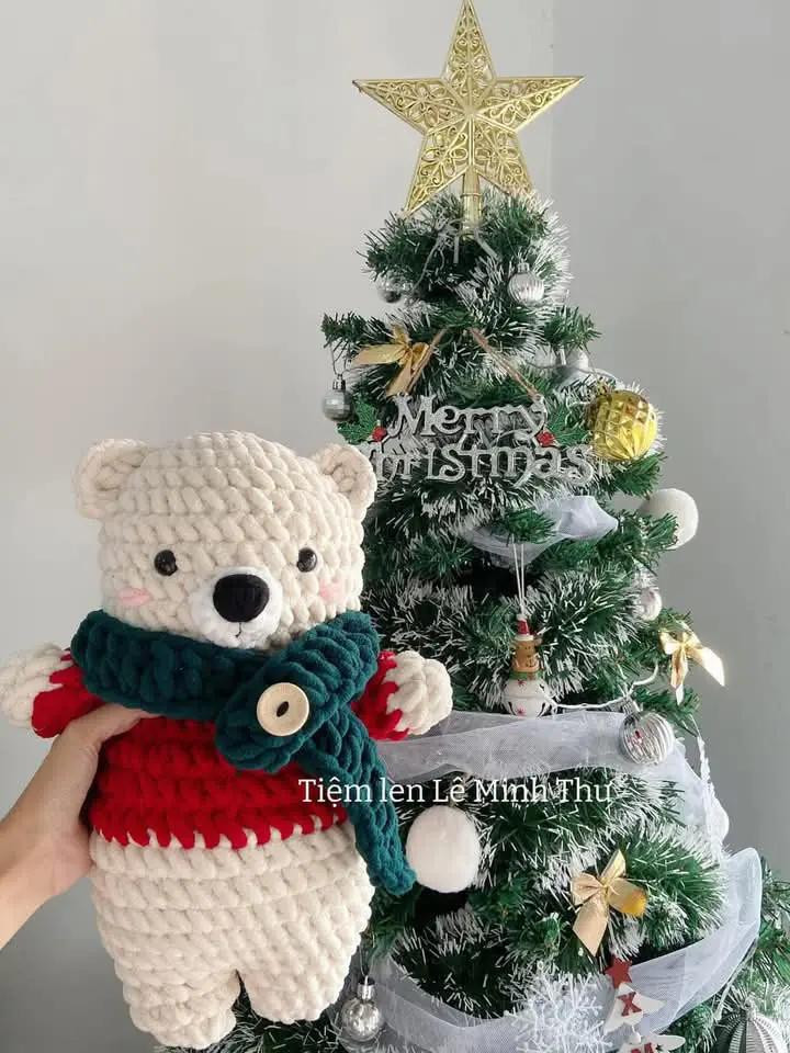 Cute Crochet Bear with Christmas Tree Background