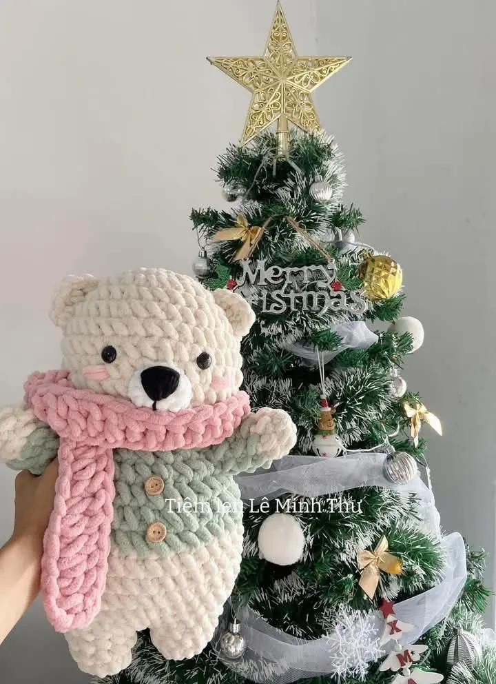 Cute Crochet Bear with Christmas Tree Background