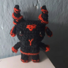 Black buffalo wool crochet pattern with red horns.