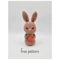 Brown rabbit crochet pattern holding carrot