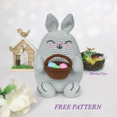 Gray rabbit crochet pattern holding an egg basket