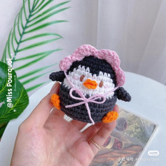 Penguin crochet pattern wearing pink hat