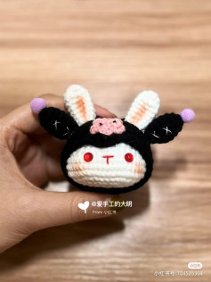 Rabbit head crochet pattern with black hat.