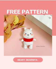 White bear crochet pattern wearing a red shirt.