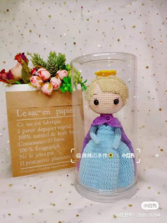 blonde doll wearing blue dress, purple cape crochet pattern