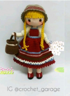 blonde doll wearing hat wearing red dress.crochet pattern