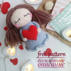 Brown hair doll crochet pattern, holding a red heart