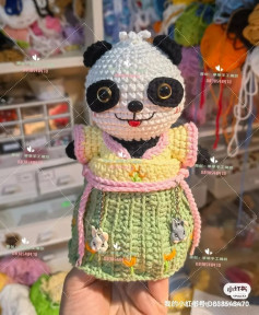 crochet pattern panda wearing blue dress.