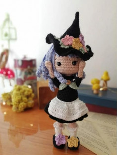 crochet pattern purple hair doll wearing black magic hat.