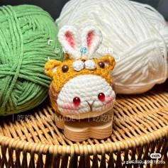 crochet pattern rabbit dumplings wearing tiger hats.