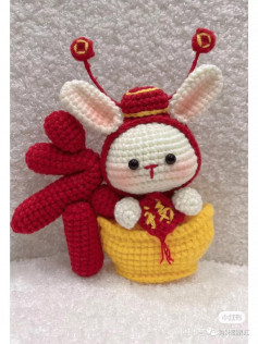 crochet pattern rabbit ears sitting in the cup.