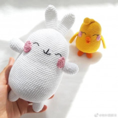 crochet pattern white rabbit with pink cheeks.