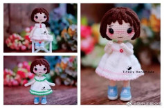 Doll in white dress with black hair.