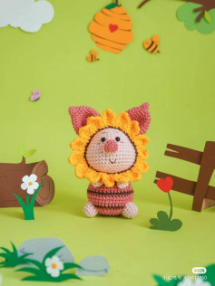 pink-nosed pig wearing a hat with yellow flowers crochet parrtern