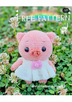 pink pig wearing white crochet pattern dress