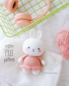 Pink rabbit crochet pattern wearing pink skirt.