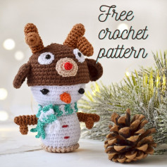 Snowman crochet pattern wearing deer hat