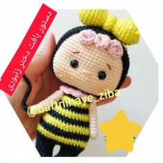 bee girl wearing black hat, pink hair, yellow plaid, black crochet pattern