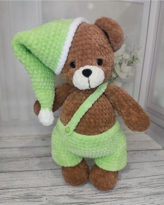 brown bear with white muzzle in green hat, green overalls, crochet pattern