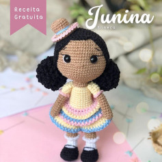 free crochet pattern black haired junina doll wearing a hat.