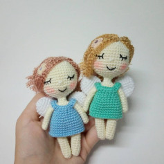 free crochet pattern blonde doll wearing blue skirt with wings.