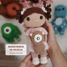 free crochet pattern brown haired doll wearing pink dress.