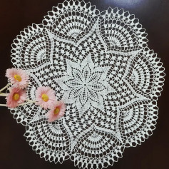 free crochet pattern circular with eight spikes and eight circles at the edge.