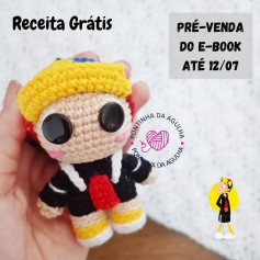 free crochet pattern doll wearing yellow hat, black shirt,
