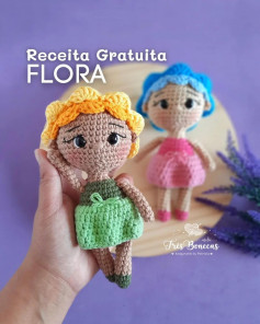 free crochet pattern doll wearing yellow hat wearing blue dress.