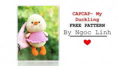 free crochet pattern duckling wearing pink dress.