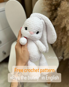 free crochet pattern elya the bunny, white rabbit with pink nose, black eyes.