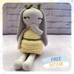 free crochet pattern long-eared rabbit wearing yellow dress.