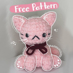 free crochet pattern pink cat, wearing brown bow.