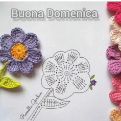 free crochet pattern purple seven-petaled flower with yellow stamens.