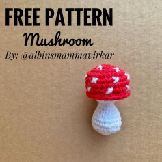 free crochet pattern red hat mushroom, white body.