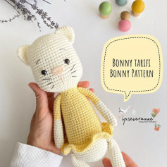 free crochet pattern white bear wearing yellow shirt.