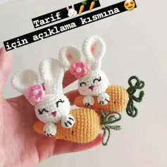 free crochet pattern white rabbit hugging carrot wearing pink bow.